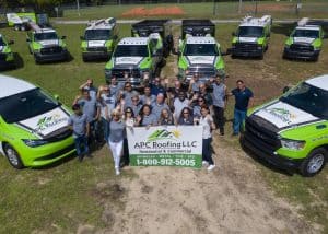 APC Roofing team with trucks for residential and commercial roofing projects in Clermont, FL.
