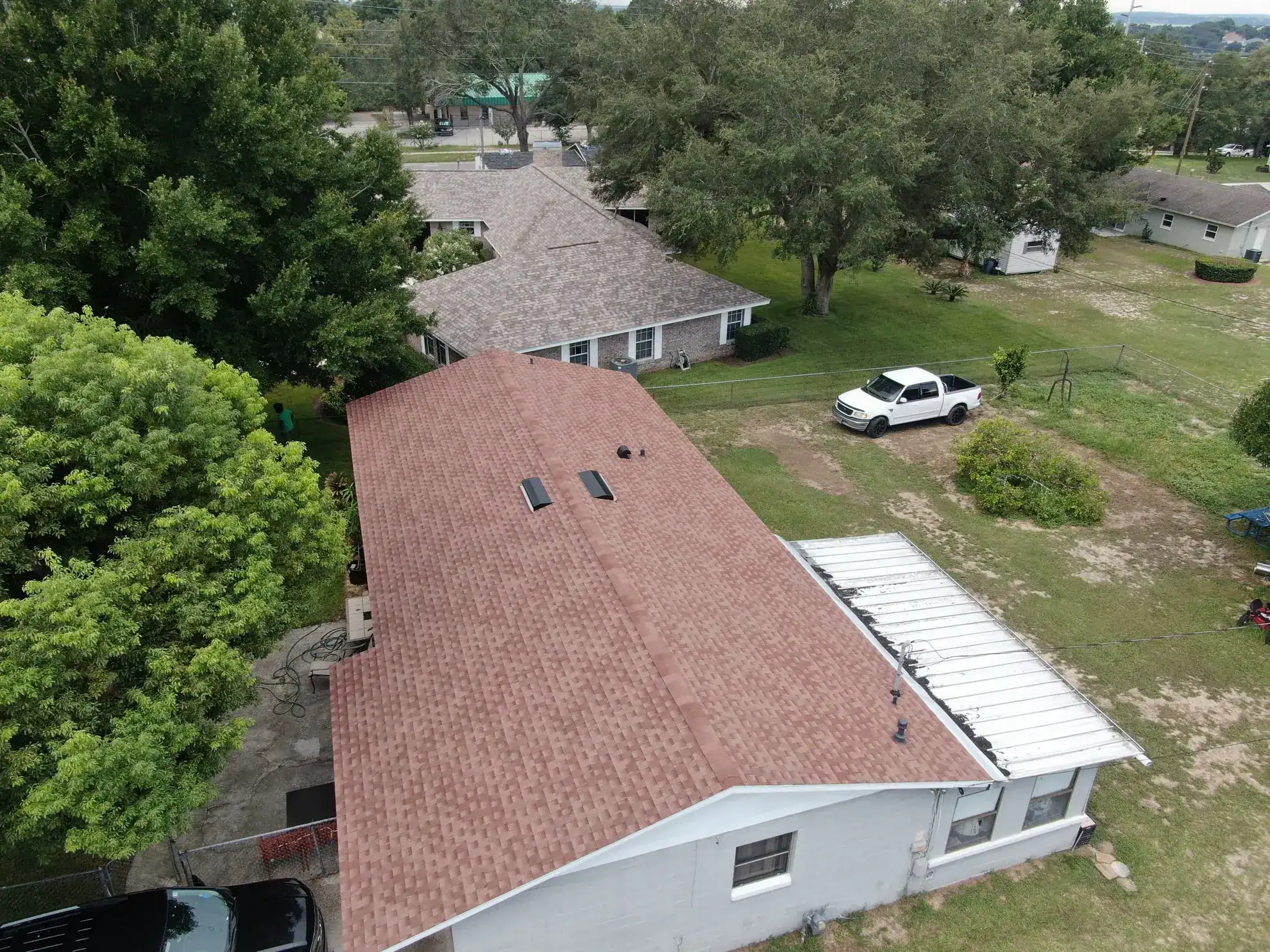 Roof replacement with new asphalt shingles on a residential home.