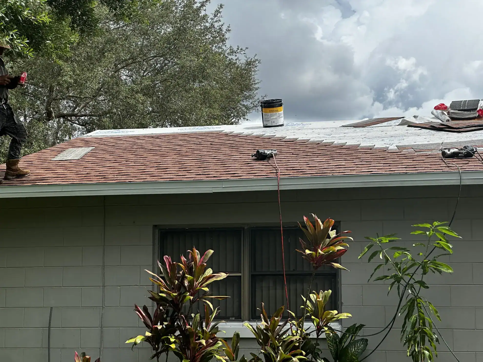 Storm damage roof repair by professional roofing crew.