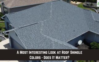 Aerial view of a residential roof with gray shingles, showcasing roof installation and storm damage.