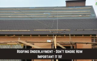 Roofers installing underlayment on a residential roof during construction.