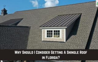 Roofers installing a new shingle roof with a dormer window on a residential house.