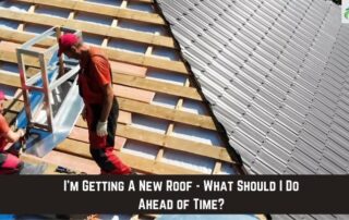 Roofers installing new roofing on residential home.