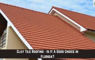 Close-up of a clay tile roof on a house with a clear blue sky background.