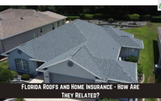 Aerial view of a house with a newly installed gray asphalt shingle roof.