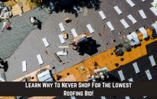 Roofers working on a residential roof installation with shingles and safety gear.