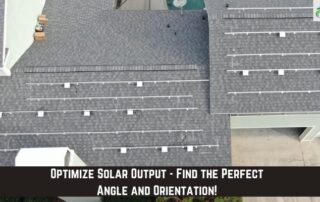 Roofers installing solar panels on a residential roof for energy efficiency.