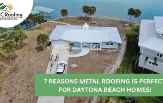 Aerial view of a house with new metal roof, surrounded by palm trees and water.