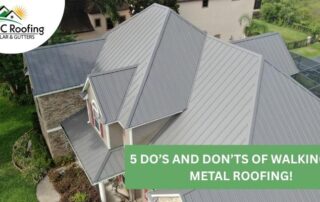 Aerial view of a residential home with a new metal roof and solar panels, showcasing professional ro.