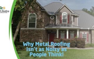 Metal roof installation on a large residential house with brick and siding exterior.