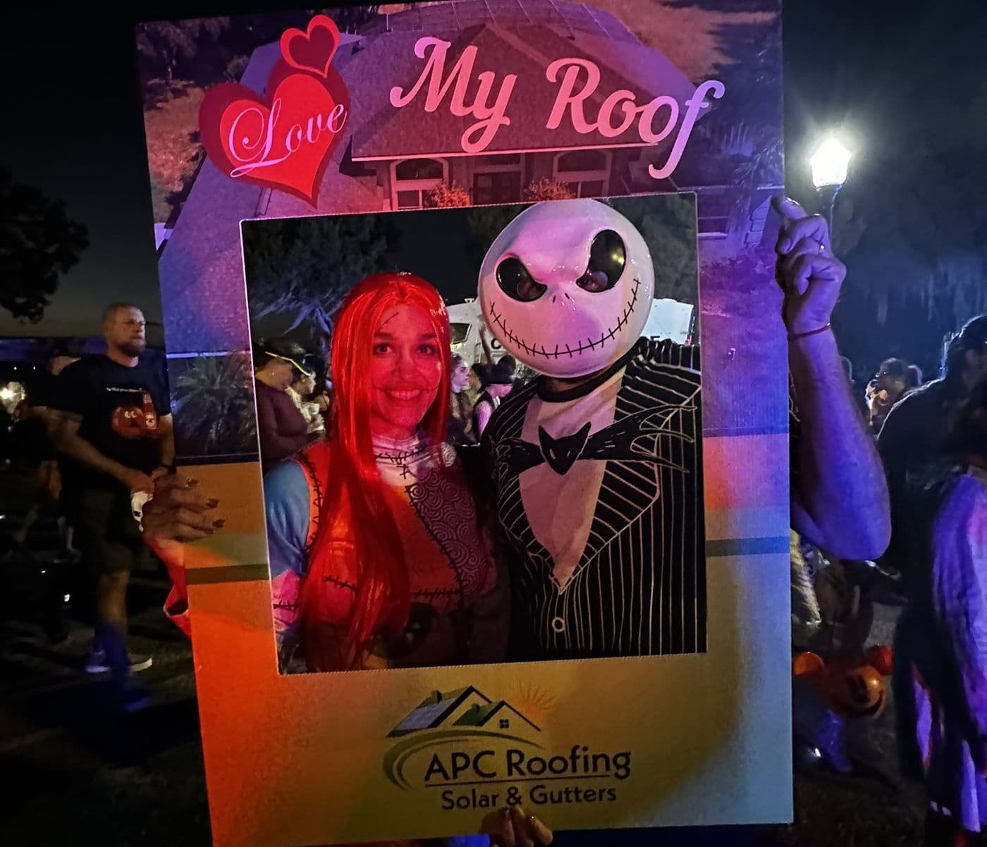 Person in costume with Jack Skellington mask at a themed event.